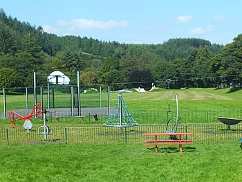 Photo Gallery Image - Play area with skate park in background